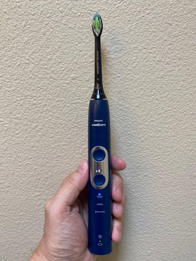 Philips Sonicare ProtectiveClean 6100 Rechargeable Electric Toothbrush, with Pressure Sensor, 3 Cleaning Modes, SmarTimer and QuadPacer, 14-Day Battery Life, Travel Case, Pink, Model HX6876/21 customer photo 1