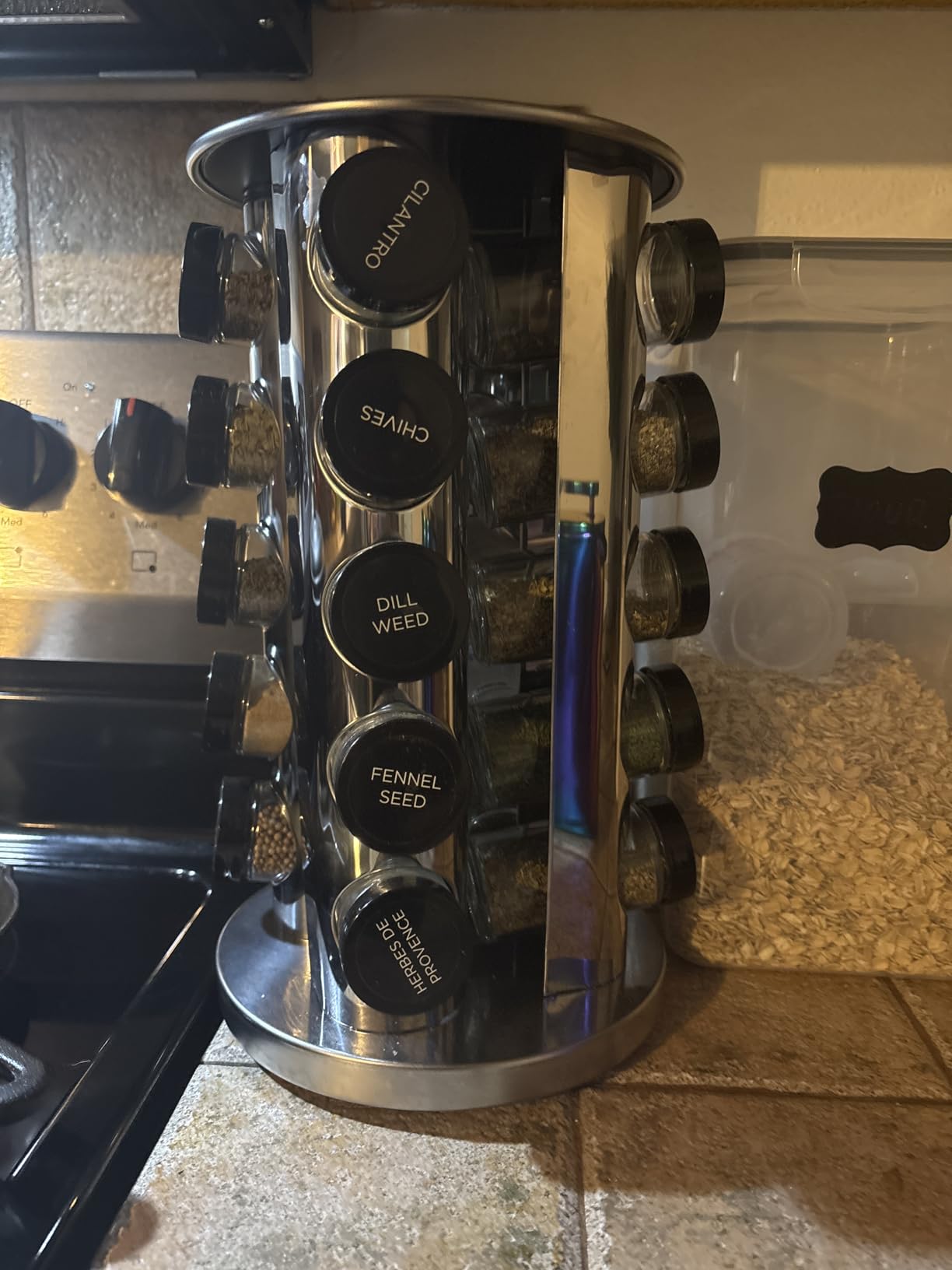 Kamenstein 20 Jar Revolving Countertop Spice Rack with Spices Included, FREE Spice Refills for 5 Years, Polished Stainless Steel with Black Caps, 30020 customer photo 2