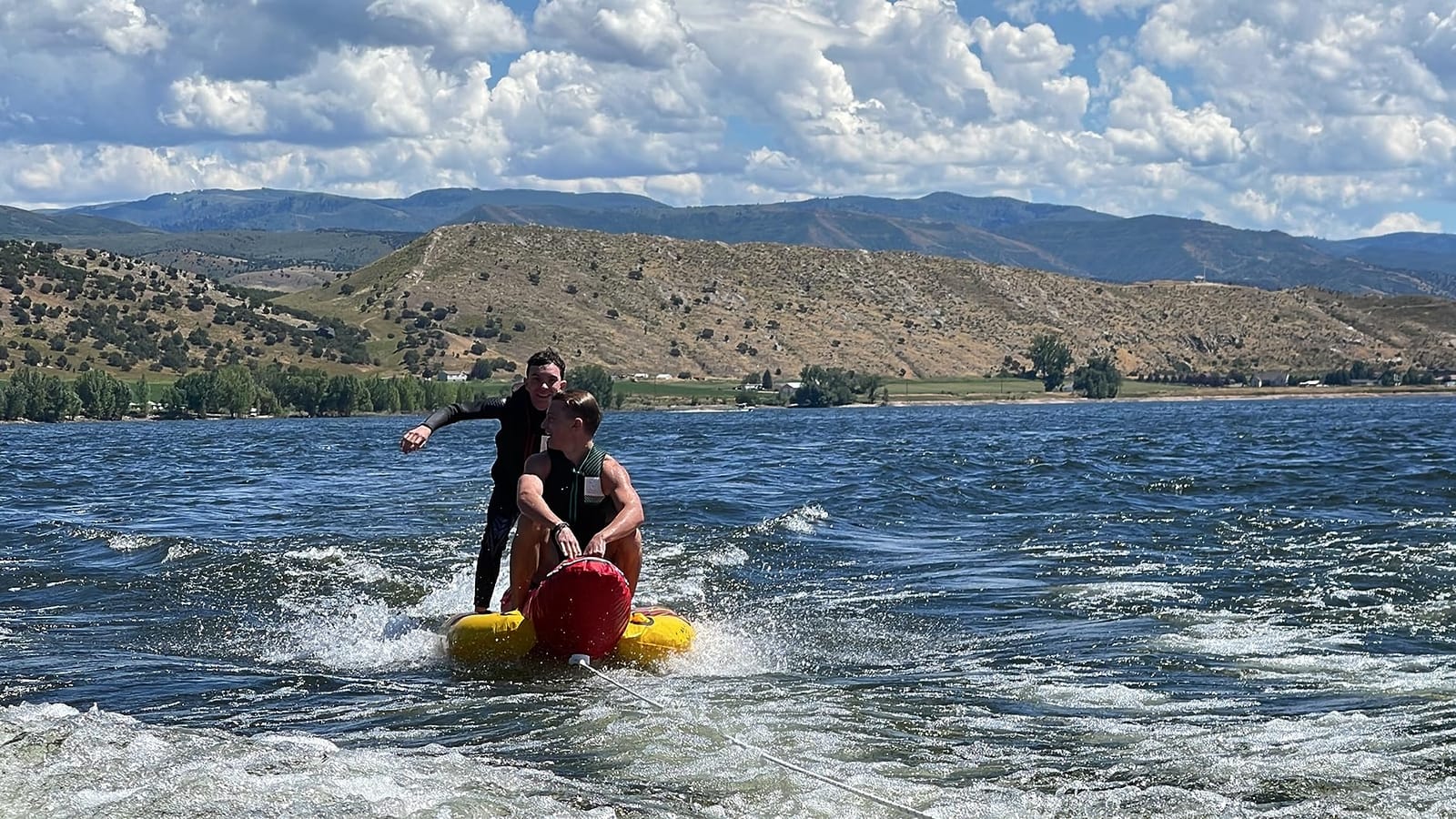 Airhead Hot Dog Towable Tube for Boating, 1-5 Rider Inflatable Boat Tube for Water Tubing, Full Nylon Cover, EVA Padding, Foam Padded Handles w/Neoprene Knuckle Guard, Speed Safety Valve customer photo 1