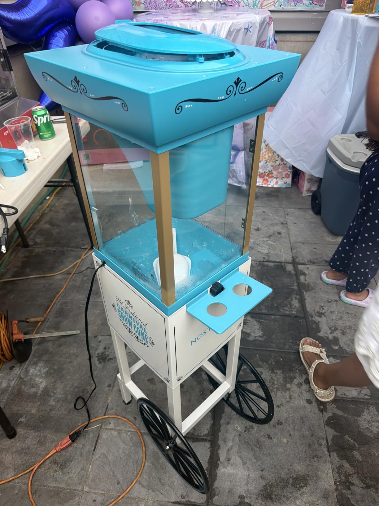 Nostalgia Snow Cone Shaved Ice Machine - Retro Cart Slushie Machine Makes 48 Icy Treats - Includes Metal Scoop, Storage Compartment, Wheels for Easy Mobility - White, Blue customer photo 1