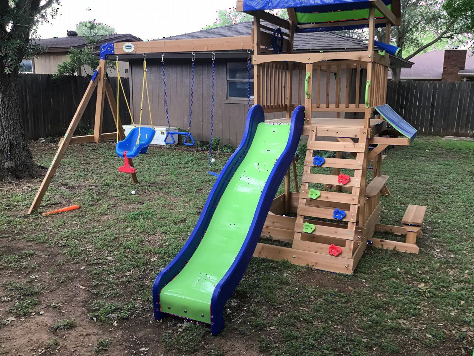 Backyard Discovery Beach Front Cedar Wood Swing Set with Wave Slide, Play Deck, Monkey Bars, Rock Wall Ladder, Shaded Picnic Area, Snack Bar, Belt Swings, Trapeze, Sandbox Area, Outdoor Playset customer photo 2