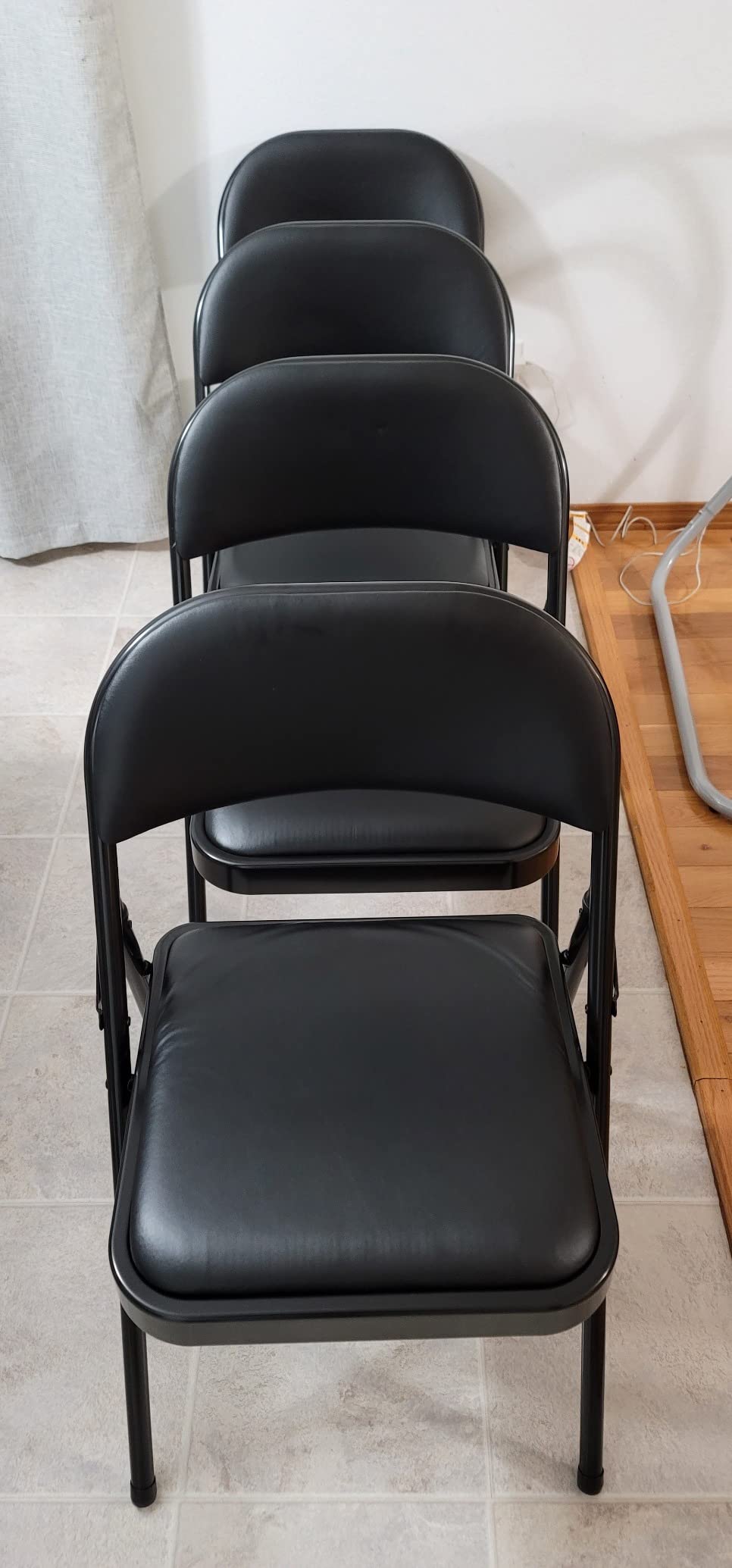 Amazon Basics Comfortable Vinyl-Padded Metal Steel Folding Chairs for Events, Easy to Fold and Store, Black, 4-Pack customer photo 1