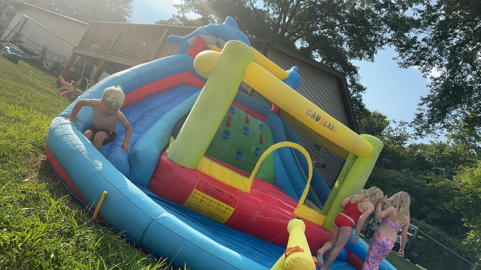 Causeair Inflatable Water Slide with Bounce House,Dolphin Styling,Splashing Pool,Double Water Cannon,Climbing Wall,Heavy Duty GFCI Blower,Inflatable Water Park Slide for Kids Backyard Summer customer photo 1