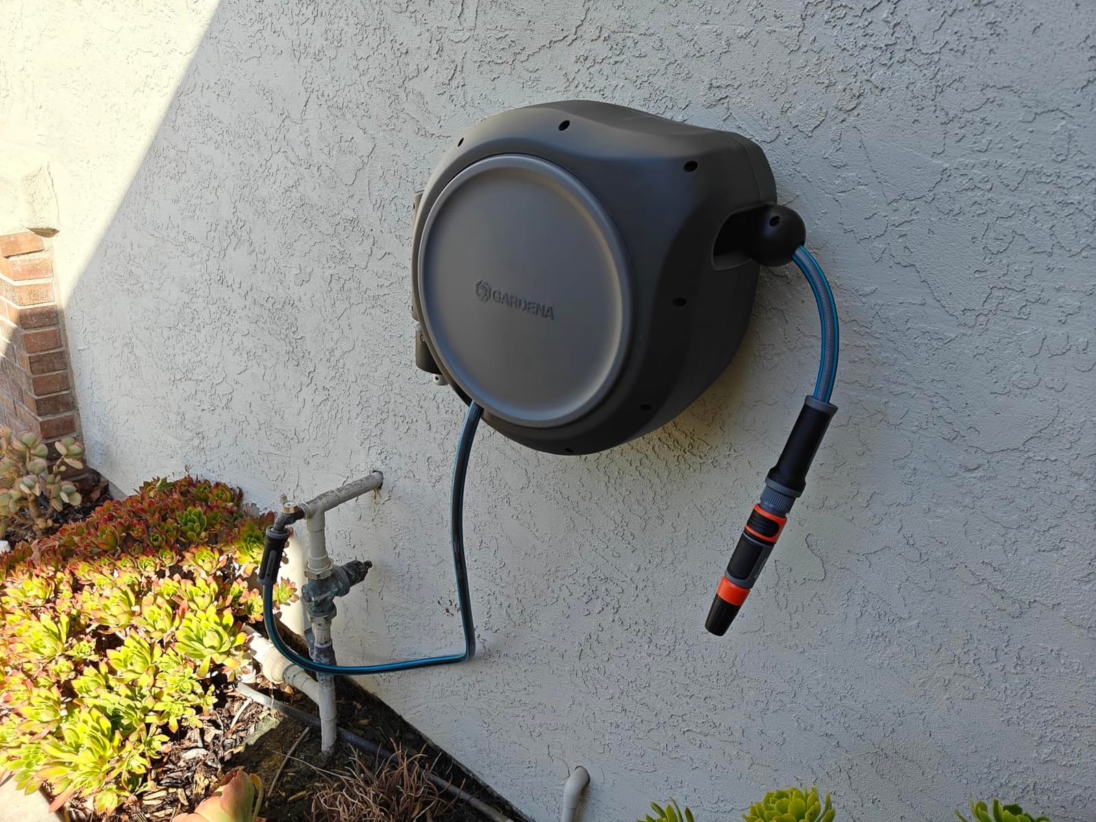 GARDENA Retractable Garden Hose Reel - 100 Feet - Auto Retract Hose Reel with 180° Swivel Wall Mount - Heavy Duty - Includes Spray Nozzle - 20505 customer photo 2